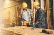 © vacancylizm - Two Carpenter working on wood craft at workshop to produce construction material or wooden furniture. The young carpenter use professional tools for crafting. DIY maker and carpentry work concept.