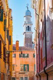 Fototapeta Uliczki - Cozy narrow streets of Venice city with old traditional architecture, Veneto, Italy. Tourism concept. Architecture and landmark of Venice. Cityscape of Venice.