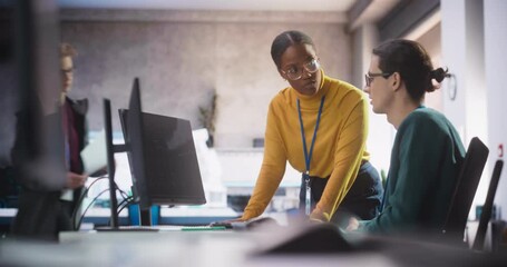 Poster - African Female and Caucasian Male Specialists Working Together in a Creative Agency, Collaborating on a Technology Project. Diverse Young Professionals Talking and Preparing for Software Presentation