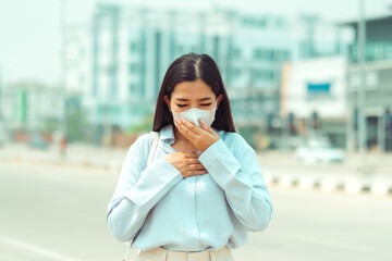 asian women wearing protection mask feels headaches and cough due to air pollution pm 2.5 air pollut