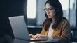 © GustavsMD - Professional woman working on laptop in office. Generative AI.