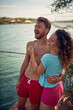 © luckybusiness - Smiling couple enjoying at morning on vacation