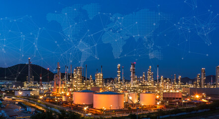 Oil refinery at twilight and night with industrial physical system icon diagram Supports the concept of Industry 4.0 technology..