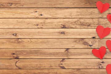 Wall Mural - Red paper hearts on wooden desk background