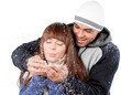© BillionPhotos.com - Happy young couple holding snowflakes and blowing isolated on white