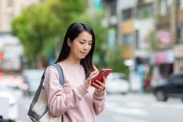 Sticker - Woman use smart phone at outdoor