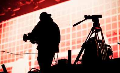 Wall Mural - cameraman silhouette in stage lights