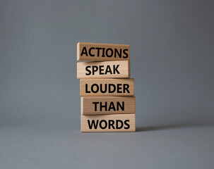 Wall Mural - Actions speak louder than Words symbol. Wooden blocks with words Actions speak louder than Words. Beautiful grey background. Business and Actions concept. Copy space.