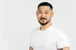 © Maria Vitkovska - Smiling asian man looking at camera isolated on white background. Handsome young guy
