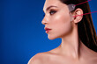 Profile side photo of stunning lady on cosmetician visit apply face lifting anti aging procedure on blue background