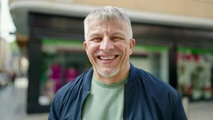 Sticker - Middle age grey-haired man smiling confident standing at street