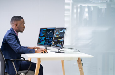 Wall Mural - Stock Market Broker Analyzing Graphs On Laptop