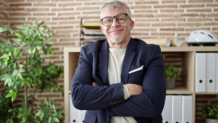 Wall Mural - Middle age grey-haired man business worker smiling confident at office