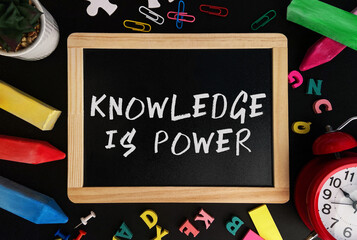 Poster - Wooden board with Knowledge is power text on a background of various colorful subjects