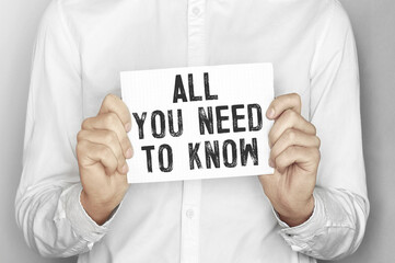 Aufkleber - Man holding a paper card with text All you need to know