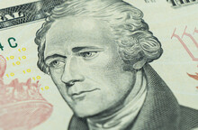 Macro Shot Portrait Of Alexander Hamilton On The One Ten Dollar Bill. Background Of The Money. 10 Dollar Bill With Alexander Hamilton Eyes Macro Shot. Money Background. Face Portrait