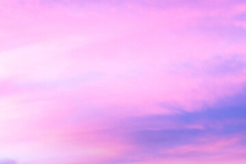 Wall Mural - sky with soft and fluffy pastel orange pink and blue colored clouds. sunset background. nature. sunr