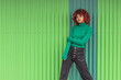 © carballo - urban girl on the street with green wall background