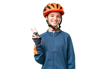 Wall Mural - Teenager cyclist girl over isolated chroma key background smiling and showing victory sign