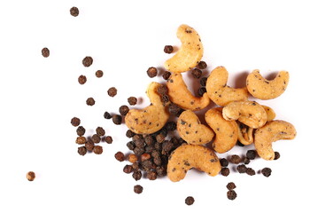 Wall Mural - Spicy cashews nuts with black pepper isolated on white, top view