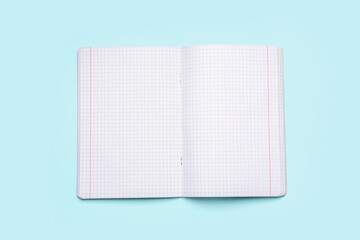 Blank copybook pages on blue background
