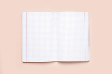 Blank copybook pages on beige background