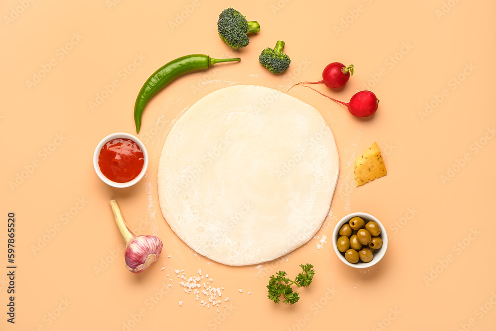 Raw dough and ingredients for preparing vegetable pie on beige background