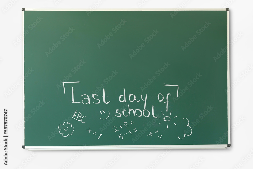 Blackboard with text LAST DAY OF SCHOOL and drawings on white wall