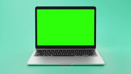 modern laptop with green screen on display for footage placement.
