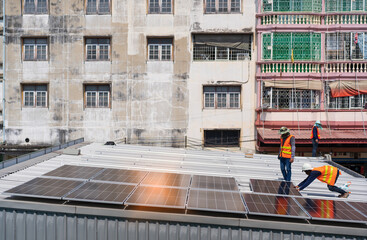 Engineer people installing solar cell panels on roof top of house for renewable energy or natural and clean solar energy with save ecology by sun light to smart electrical system and new technology