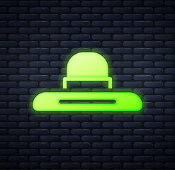 Sticker - Glowing neon Gardener, farmer or agricultural worker hat icon isolated on brick wall background. Vector