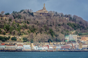 Poster - Mountain Urgull with Jesus Christ sculpture in San Sebastian city also known as Donosti, Spain