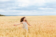 © Ірина Савченко - A young girl walking in a wheat field, girl in the field, wheat field, field of spikeletsA young girl walking in a wheat field, girl in the field, wheat field, field of spikelets