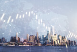 Fototapeta Nowy Jork - Double exposure of abstract creative financial chart hologram and world map on New York city skyscrapers background, research and strategy concept
