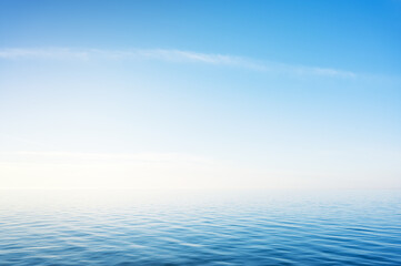 Wall Mural - blue sky over sea or ocean water surface