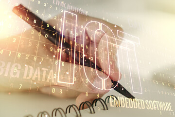 Poster - Double exposure of creative IOT hologram with man hand writing in notebook on background, research and development concept
