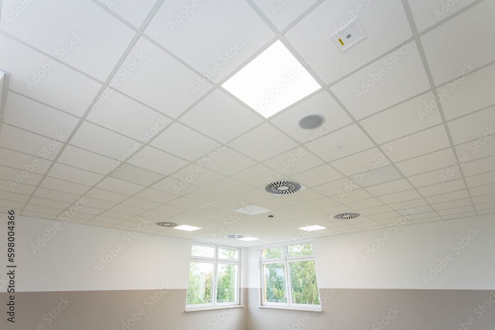 Ceilingview Bottom view of the panel ceiling on the diagonal of the room with a ...