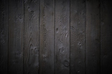 Wall Mural - Beautiful wooden background made of boards painted black.