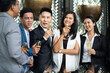 © NVB Stocker - Group Of Asian Friends Enjoying Evening Drinks in bar. Celebration, Party People Christmas and Happy new year concept. Asian business people in party.
