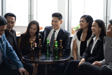 Wall Mural - Group Of Asian Friends Enjoying Evening Drinks in bar. Celebration, Party People Christmas and Happy new year concept. Asian business people in party.