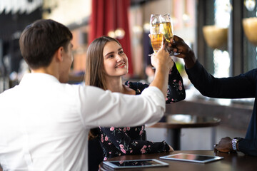 Wall Mural - Celebration, Party People Christmas and Happy new year concept. Group Of Happy Friends Enjoying Evening Drinks in birthday party at the club.