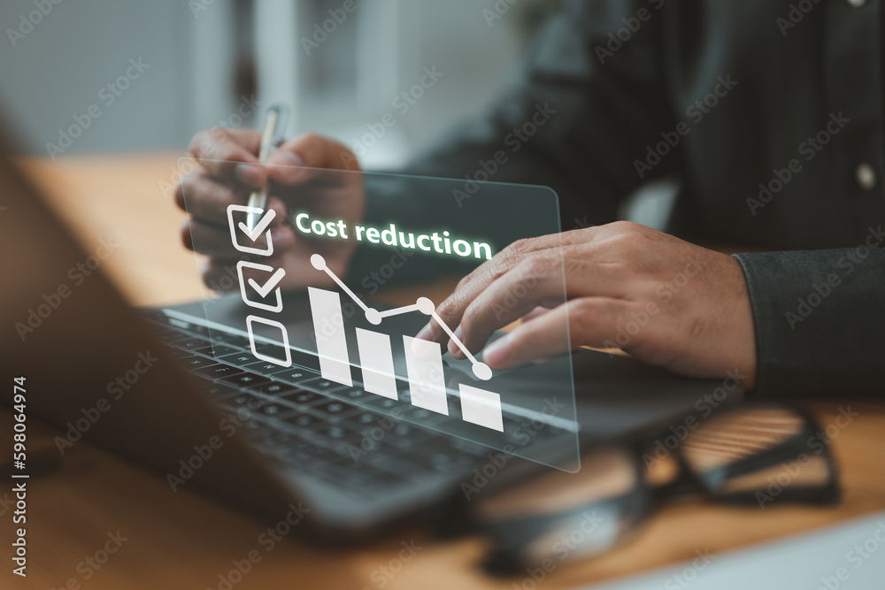 Businessman lowering the arrow of a graph, concept of cost reduction ...
