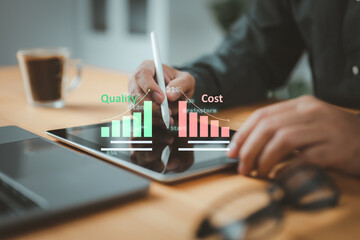 Fototapete - Businessman uses a tablet to manage cost and quality control, importance of effective business strategies and project management. The quality control growth graph and cost reduction