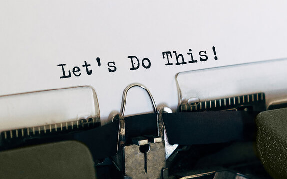 Text Lets do this typed on retro typewriter