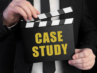 Aufkleber - A businessman holds up a сlapperboard with text Case study