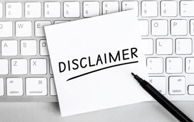Aufkleber - White paper with text Disclaimer lying on the keyboard