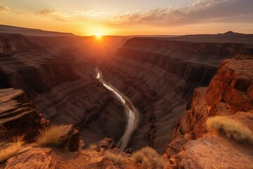 Wall Mural - Rugged canyon at sunset, featuring a narrow river winding through the steep cliffs against the orange sky. Generative AI