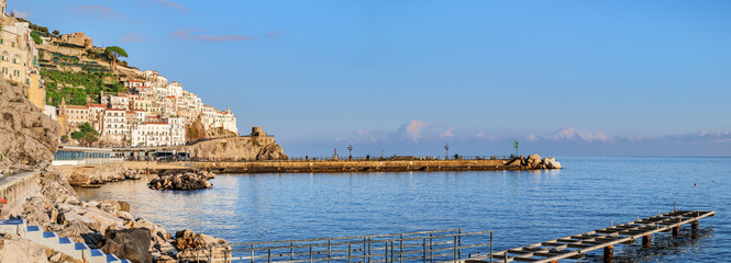 Wall Mural - Amalfi, Italy. View of Amalfi from Via Lungomare dei Cavalieri, on a sunny winter day. Banner header image. 2023-12-28.