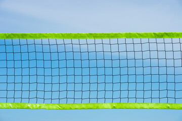 Wall Mural - Beach volleyball and beach tennis net on blue sky background. Summer sport concept. Horizontal sport theme poster, greeting cards, headers, website and app