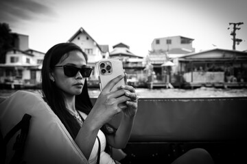 girl in a boat taking a selfi